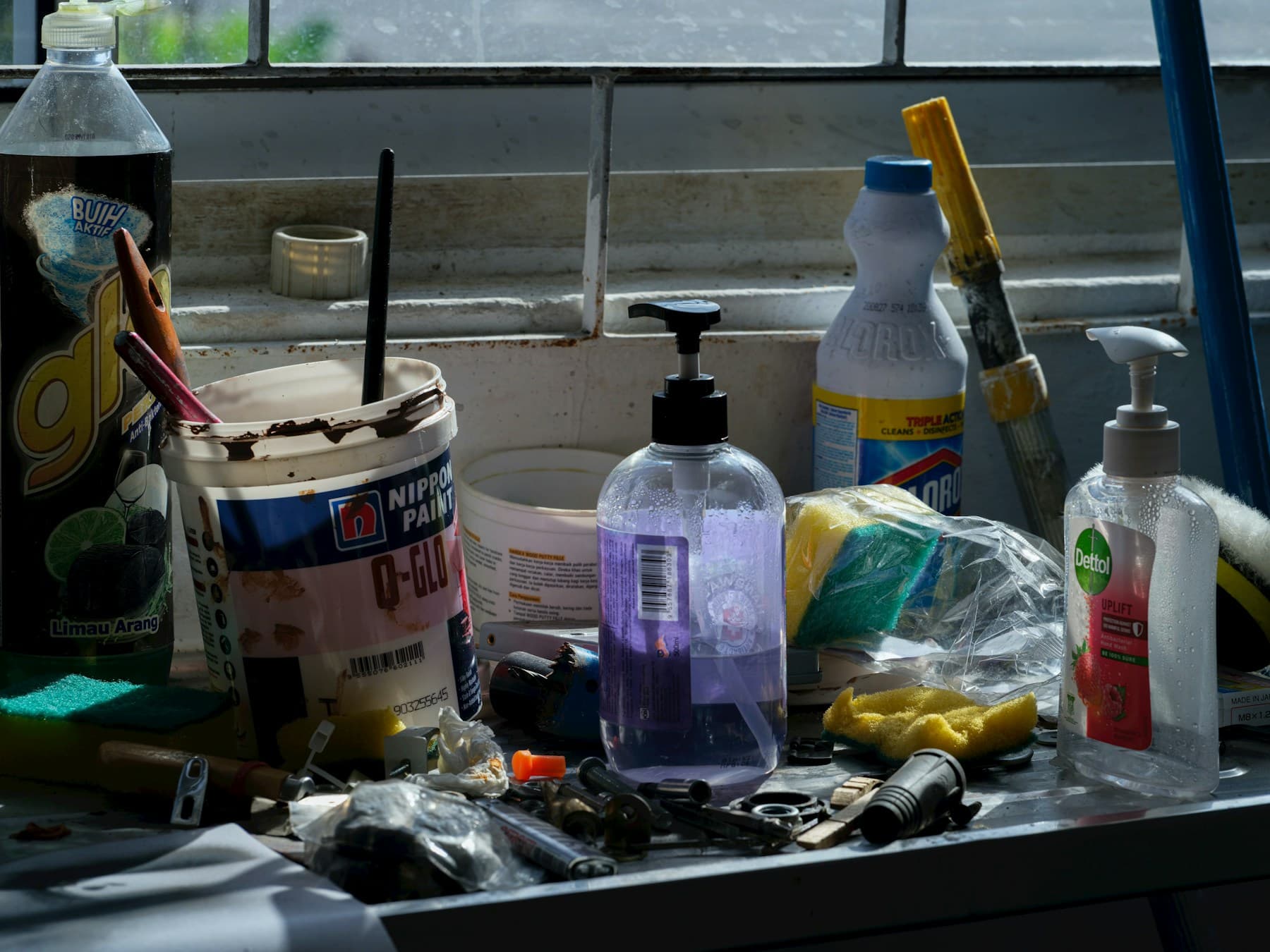 Assorted cleaning supplies arranged on a counter