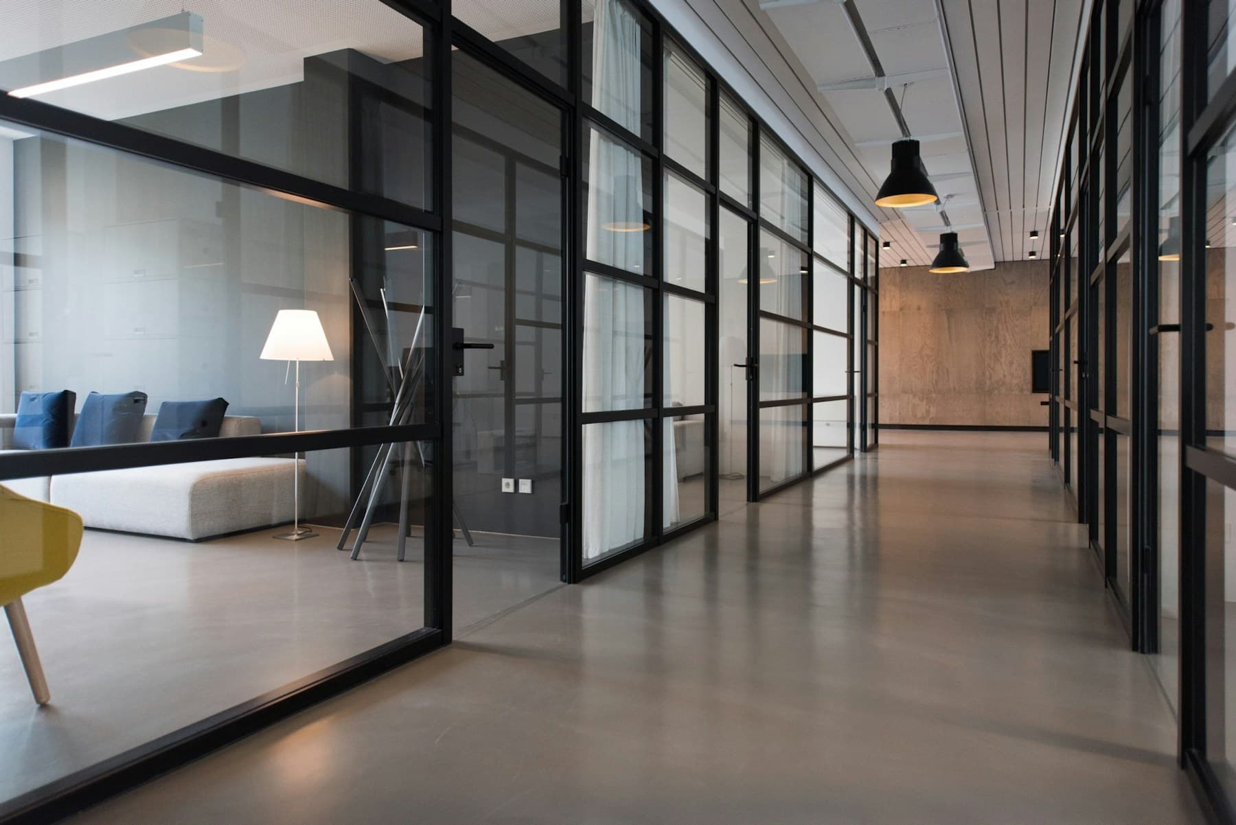 Bright office hallway with glass doors