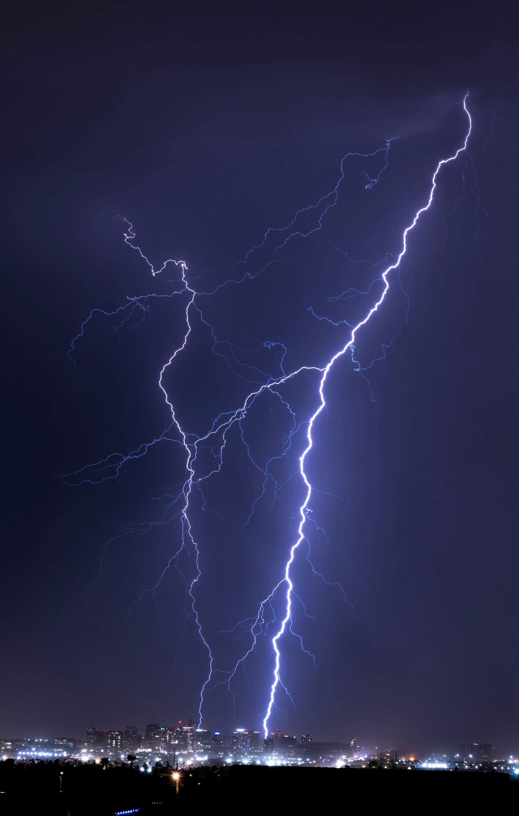 Phoenix skyline at night during a lightning storm
